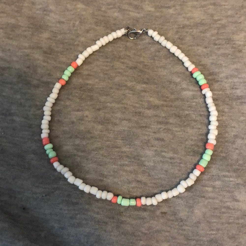 white neckalace with mint green and pink details